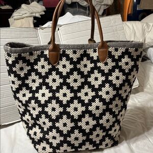 Annie Selke’s woven tote with leather handles and inside slip pocket EUC